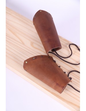 Leather bracers with golden rivets