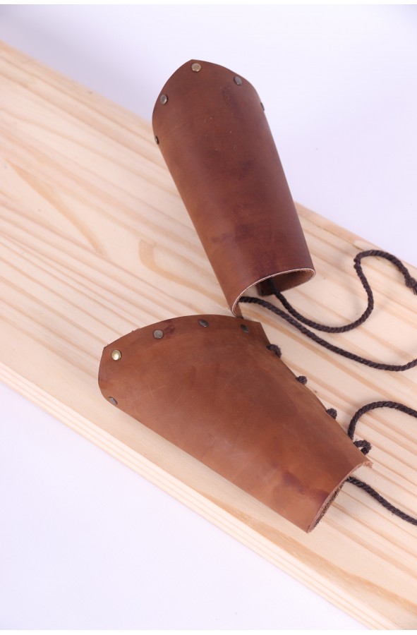 Leather bracers with golden rivets