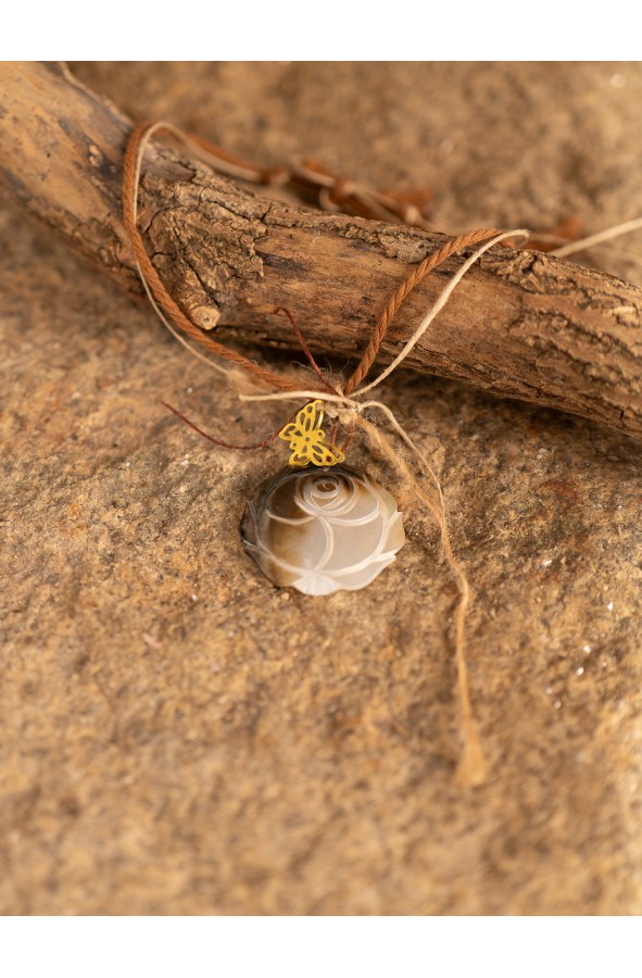 Choker with carved natural shell rose...